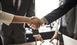 man and a woman shaking hands
