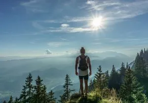 Man standing on top of a mountain.