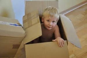 a child in a cardboard box