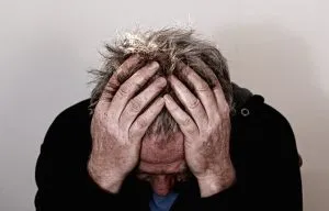 A man thinking whether to buy or rent in Hong Kong.