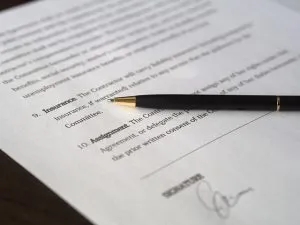 A contract and a pen on top of it.