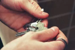 A person holding a set of keys.