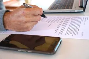 a man signing the contract
