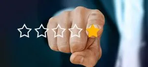 a finger pointing at one yellow star
