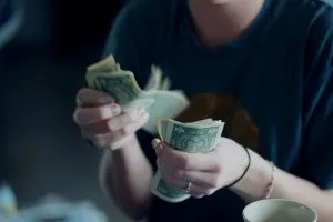 -hands counting money