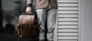 a man carrying a bag