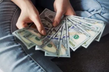 -a hand holding money