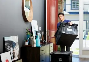 - a man carrying the box