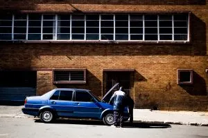 Two men checking the car