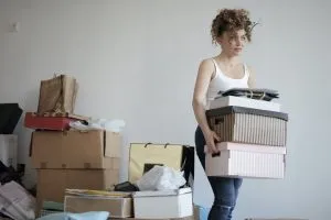 woman carrying boxes