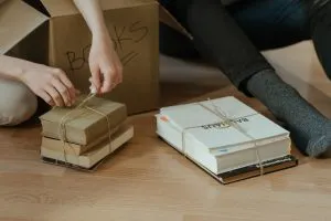 people unpacking books