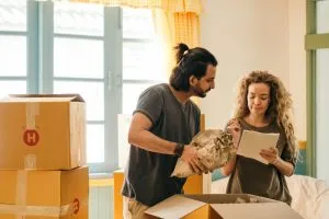 Picture of a couple packing for the move