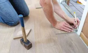 person repairing the floors