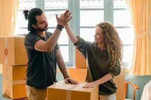 Picture of two people packing boxes