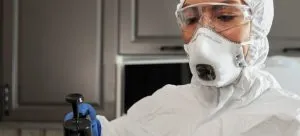 -a person disinfecting the space