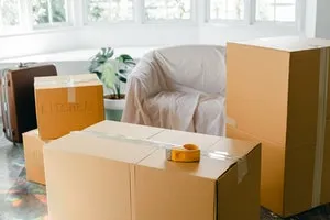 Empty apartment with packed carton boxes when leaving Hong Kong after college