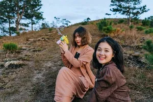 Two girls sitting on the grass