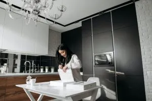 a girl in the kitchen with boxes
