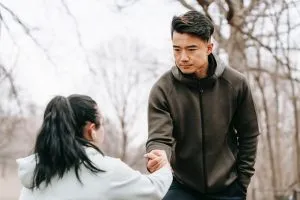 a guy helping a girl