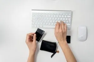 a person holding a credit card
