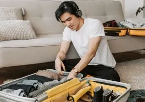 a guy packing for a summer move in Hong Kong