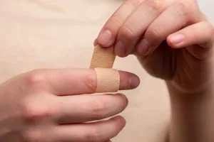 person using band aid