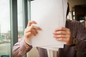 a man holding papers