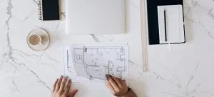 woman looking at floor plan