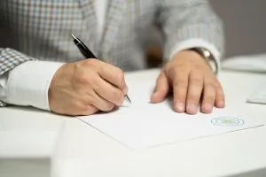 a man signing papers