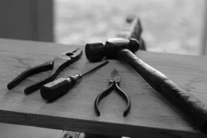 hand tools on the table - pack an antique clock for a long distance move