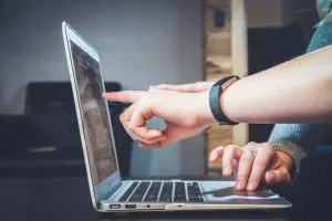 people looking at the laptop