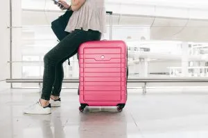 A way to enjoy your international moving experience is to travel with one pink suitcase
