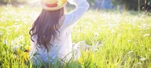 woman sitting in the grass