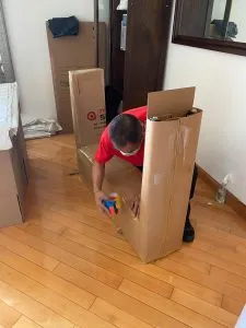 ReloSmart mover packing the box