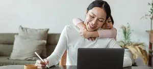 A daughter hugging her mom