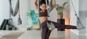 woman exercising after which she will prepare exercise equipment