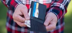 Man pulling money from a wallet