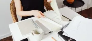 Woman packing documents for relocation to Canada
