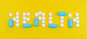 Picture of pills on a yellow surface
