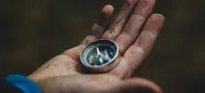 Picture of a person holding a compass