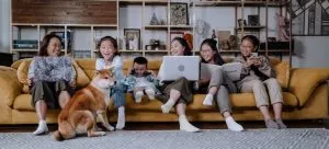 A family sitting on a couch talking about the overseas move