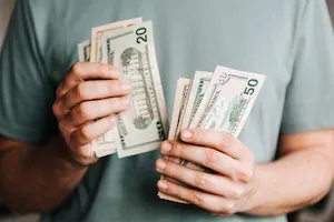 A man holding banknotes