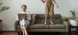 a woman reading on the laptop about moving from Hong Kong to Australia