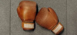 brown boxing gloves on the floor