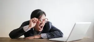 Man looking up prices for profesional cleaners