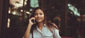 woman talking to a landlord as an example of how to get your security deposit back when moving out