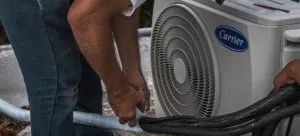 A man instaling air conditioner