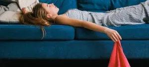 A girl sleeping on the couch.
