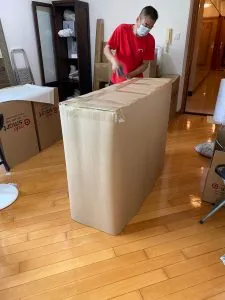 Relosmart mover packing and sealing a cardboard box