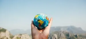 a person holding a globe
